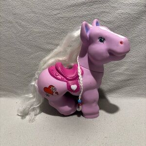Pony 11” lavender with pink saddle silver hair and a braid red heart